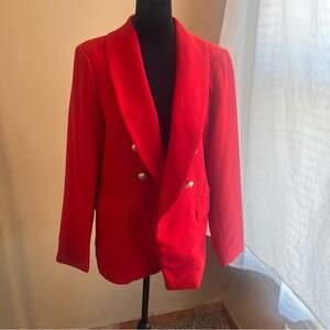Red double breasted jacket with gold buttons.
